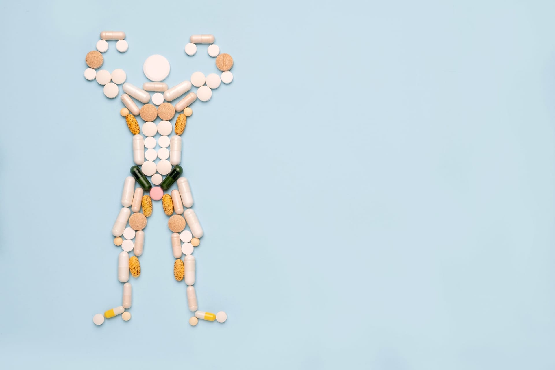 Die Silhouette eines Bodybuilders, zusammengesetzt aus Tabletten